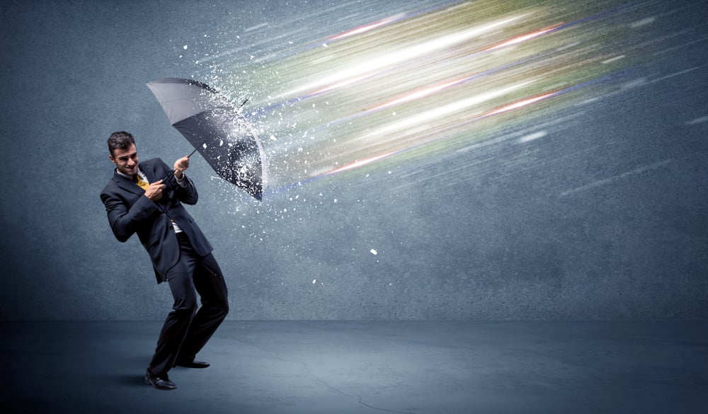 Business man defending light beams with umbrella concept on background Business man defending light beams with umbrella concept on background